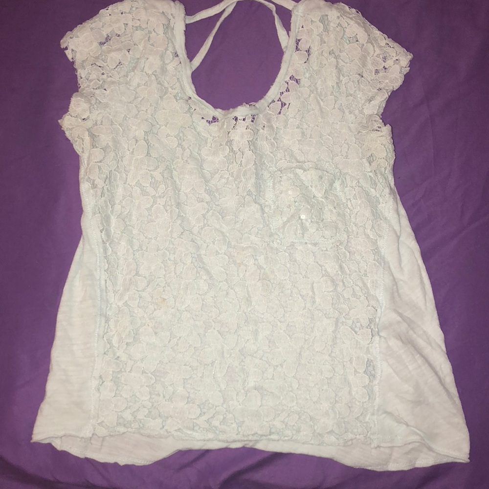 A very light blue shirt with little sparkles